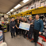 Decwells team with cheque for Our Lady's Hospice