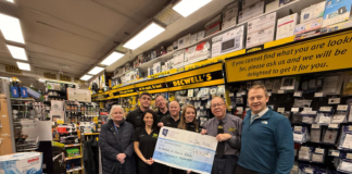 Decwells team with cheque for Our Lady's Hospice